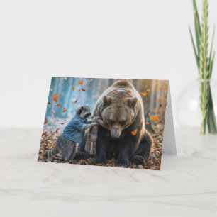 Waschbär bindet einem Bären einen Schal um Karte