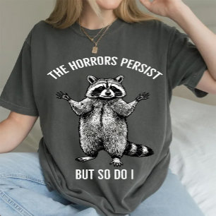 Waschbär The Horrors Persist But So Do I  T-Shirt
