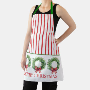Wasserfarbene grüne Kränze mit roten Gingham-Schle Schürze