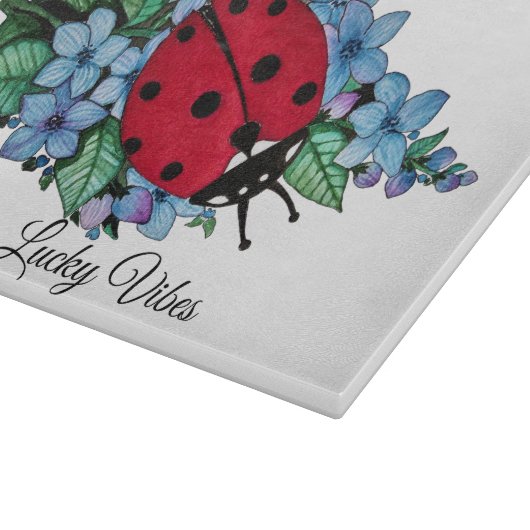 Wasserfarbener Niedlicher Ladybird mit blauen Blum Schneidebrett (Ecke)
