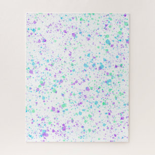Wasserfarbenspritzer auf weißem Puzzle