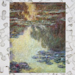Wasserlilien von Claude Monet, Vintage Kunst Puzzle<br><div class="desc">Wasserlilien von Claude Monet sind ein Vintager Impressionismus, ein Kunstmalerei mit Wasserlilien in einem Teich im Garten von Monet auf seiner Zuhause in Giverny, Frankreich. Die wilden Baumreflektionen sind im Wasser mit einem Sonnenuntergang. Claude Monet malt gerne "en plein air" oder "im Freien". Eine Serie von über 250 Wasserlilien Blume...</div>
