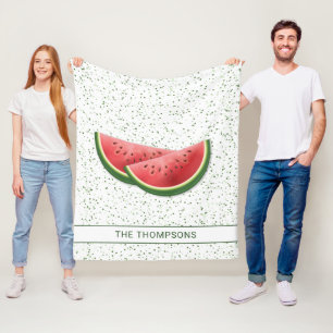 Wassermelonen-Fruchtscheiben und grüne Punkte mit Fleecedecke