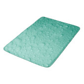 Wassertropfen auf blauer Oberfläche Badematte (Schrägansicht)