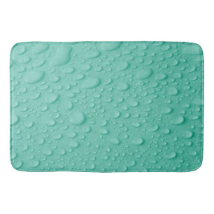 Wassertropfen auf blauer Oberfläche Badematte