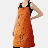 Wassertropfen auf orangefarbener Oberfläche Schürze (InSitu)