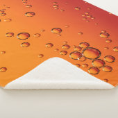 Wassertropfen auf orangefarbener Oberfläche Sherpadecke (3/4)