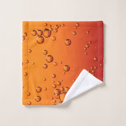 Wassertropfen auf orangefarbener Oberfläche Waschlappen (Waschlappen)