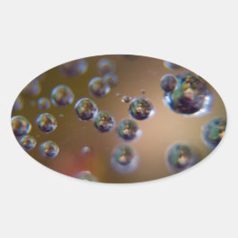 Wassertropfen in Bewegung Ovaler Aufkleber