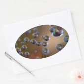 Wassertropfen in Bewegung Ovaler Aufkleber (Umschlag)