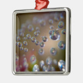 Wassertropfen in Bewegung Silbernes Ornament (Links)