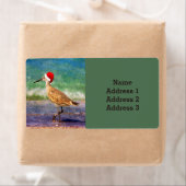 Wasservogel in Weihnachtsmannmütze am Strand Weihn (Insitu)