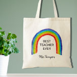 Watercolor Rainbow Teacher Danke für Ihr Geschenk Tragetasche<br><div class="desc">Diese Teacher's Tote Tasche ist mit einem kinderähnlichen Regenbogen und den Worten "Bester Lehrer je" dekoriert. Einfach mit dem Namen Ihres Lieblingslehrers anpassbar.</div>