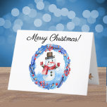 Watercolor Retro Snowman Wreath Frohe Weihnachten<br><div class="desc">Eine lustige, skurrile Weihnachtskarte mit einem Retro-Schneemann, der in einer roten Beere gerahmt ist, goldenen Sternen und blauen Blätter mit Kranz. Ändern Sie einfach den stylischen Skripttext vorne, innen und hinten, um ihn mithilfe der Vorlage zu speichern. Der weiße Umschlag ist inbegriffen oder markieren Sie "none" für den reduzierten Preis....</div>