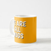 "We Are All Mugs” Mug – Cheeky Ceramic Orange Kaffeetasse (Vorderseite Links)
