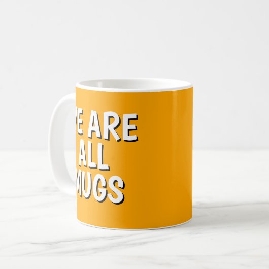"We Are All Mugs” Mug – Cheeky Ceramic Orange Kaffeetasse (Vorderseite Links)