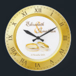 Wedding Anniversary Gold Roman Numerals Custom Große Wanduhr<br><div class="desc">A simple, elegant clock in gold tones, with Roman numerals. The frame that functions as part of the clock is also a frame for your favorite wedding photograph. Keep the sample image of a pair of gold and platinum wedding rings, or replace it with your own image for full personalization....</div>