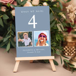 Wedding Foto Fun Dusty Blue Tischnummer<br><div class="desc">Genießen Sie Ihre Hochzeitsempfangsdekoration mit diesen verstaubten blauen Tischnummern-Karten, wo jede Tischnummer den Fotos der Braut und des Bräutigams im gleichen Alter entspricht. Zum Beispiel, für Tabelle 4, personalisieren Sie die Tischnummer mit "4" und fügen Sie Fotos der Braut und Bräutigam, wenn sie 4 Jahre alt waren. Wenn Sie eine...</div>