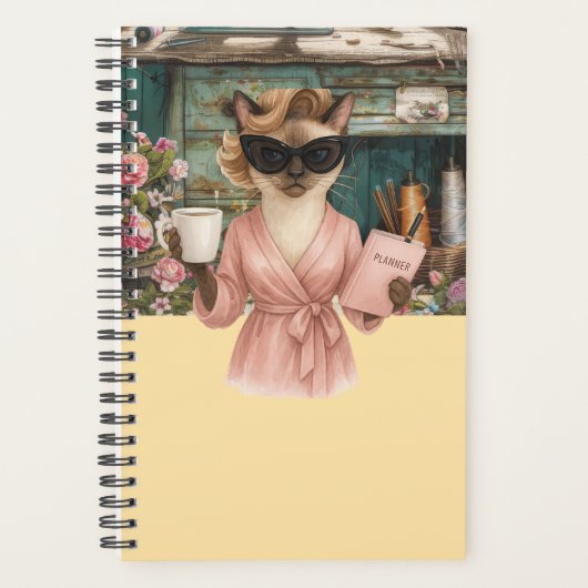 Weibliche Katze hält Terminkalender Planer (Vorderseite)