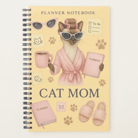 Weibliche Katze hält Terminkalender Planer (Vorderseite)