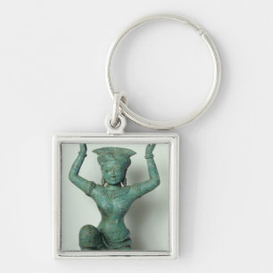 Weibliche Zahl Kniens benutzt, um a zu stützen Schlüsselanhänger