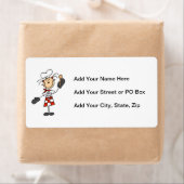 Weiblicher Koch mit Mitten und Holzlöffel (Insitu)