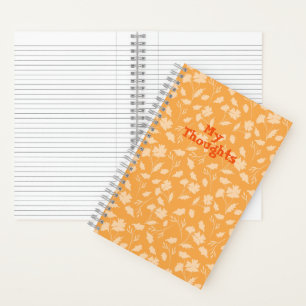 Weiche Blumenmuster auf orangefarbenem Hintergrund Notizblock
