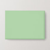 Weicher, blassgrüner Hintergrund mit subtiler Vert Button (Vorderseite)