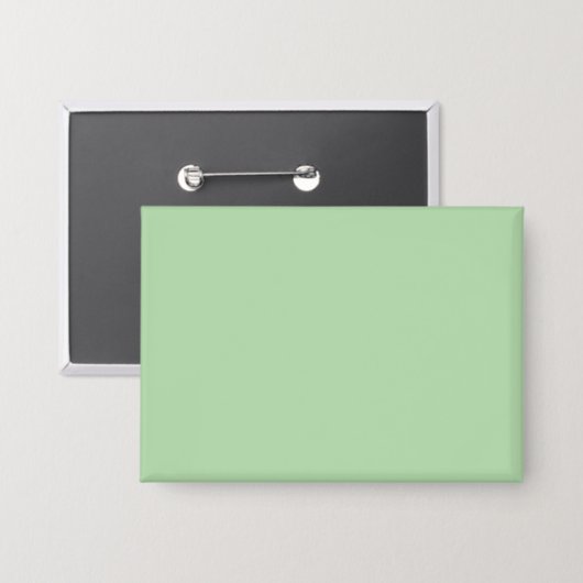 Weicher, blassgrüner Hintergrund mit subtiler Vert Button (Vorderseite/Rückseite)