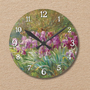 Weiden und Schwertlilien an einem Bach Runde Wanduhr