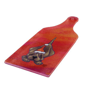 Weihnachten des Hundes auf Rot Schneidebrett