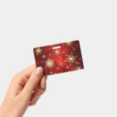 Weihnachten Goldene Schneeflocken im roten Hinterg Ausweis (Handheld)