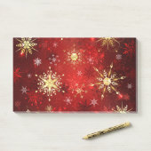 Weihnachten Goldene Schneeflocken im roten Hinterg Post-it Klebezettel (Auf Schreibtisch)