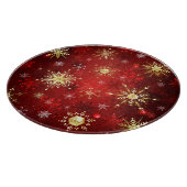 Weihnachten Goldene Schneeflocken im roten Hinterg Schneidebrett (Ecke)