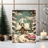 Weihnachten im rosa Oldtimer vor verschneiter Hütt Karte