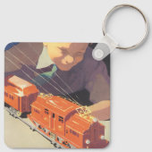 Weihnachten, Junge spielen mit Spielzeugbahnen Schlüsselanhänger (Rückseite)