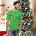 Weihnachten T-Shirt<br><div class="desc">Das perfekte Shirt zum Weihnachtsgebäck: mit einem personalisierten Namensschild,  kitschigem Weihnachtsgebäck und einem Bonbons in der Tasche!</div>