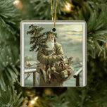 Weihnachten, Viktorianischer Weihnachtsmann mit Sp Keramikornament<br><div class="desc">Vintage Illustration Weihnachtsfeierdesign mit einem Viktorianischen Weihnachtsmann,  der durch den Schnee verlassend Fußspuren geht. Er trägt einen Weihnachtsbaum und einen Körbchen Spielzeug auf einem bewölkten Abend,  wobei der Mond durch die Wolken strahlt. Ursprünglich eine skandinavische Postkarte mit dem Text: Gott Jul oder Frohe Weihnachten.</div>