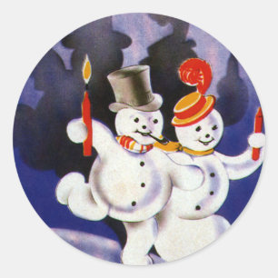 Weihnachtliche tanzende Schneemänner mit Kerzen im Runder Aufkleber