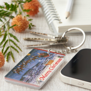 Weihnachtlicher Santa Claus beim Fliegen seines Sc Schlüsselanhänger