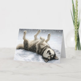 Weihnachtlicher Sibirischer Husky macht einen Schn Feiertagskarte