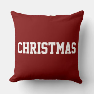 Weihnachtlicher Text auf festlichem Vintage-Rot Kissen