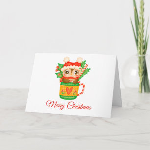 Weihnachts-Baby-Eule in einer Tasse mit Zuckerstan Feiertagskarte
