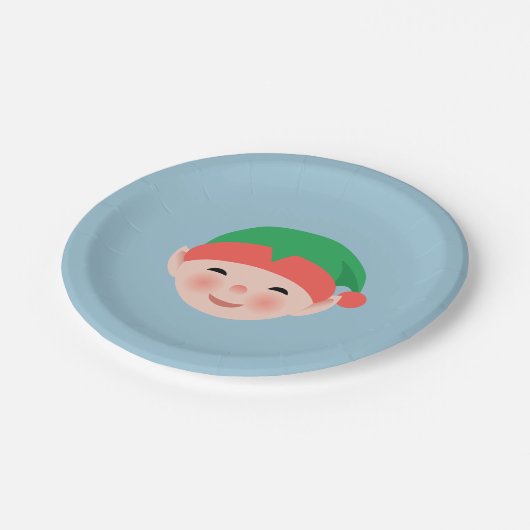 Weihnachts-Elf in einem grünen Hut auf Light Blue Pappteller (Schrägansicht)