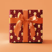 Weihnachts-Haus Gingerbrett auf dunkelrotem Hinter Geschenkpapier