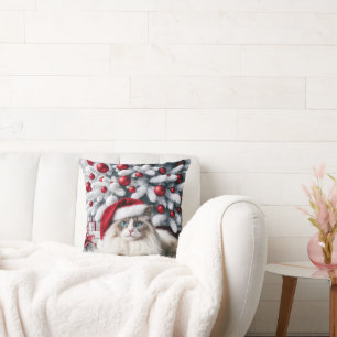 Weihnachts-Ragdoll-Katze In einer Weihnachtsmannmü Kissen