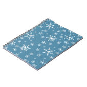 Weihnachts-Schneeflocke auf blau Notizblock (Linke Seite)
