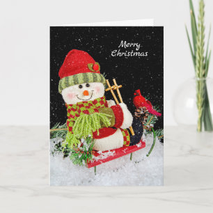 Weihnachts-Schneemann auf Schlitten Feiertagskarte