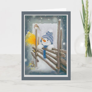 Weihnachts-Schneemann schaut auf einen Vogel Feiertagskarte