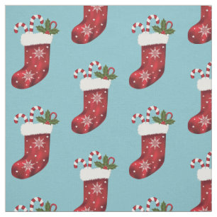 Weihnachts-Strumpf mit Süßigkeiten auf blau Stoff